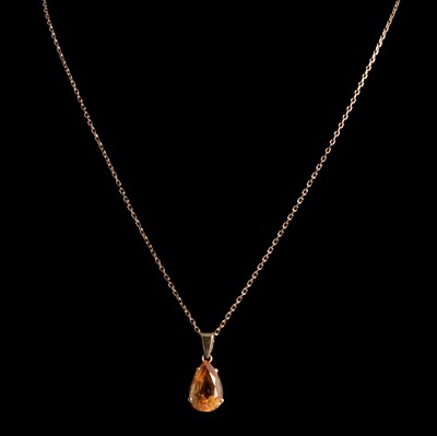 Lot 370 - A citrine pendant and chain and a garnet ring.