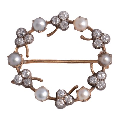 Lot 198 - A diamond and pearl garland brooch.