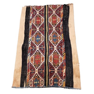 Lot 567 - Embroidered Kelim strip rug (a fragment),...