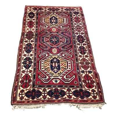 Lot 565 - Azerbaijan rug, three tarantula-like motifs,...