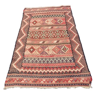 Lot 560 - Large Caucasian flatweave rug, banded central...