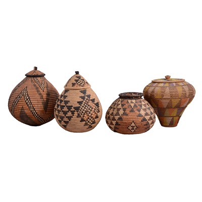 Lot 199 - Three Zulu woven baskets; and a beaded woven basket.