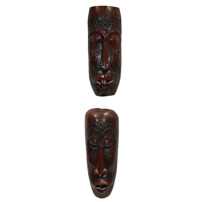 Lot 518 - Two African carved and stained softwood tribal masks