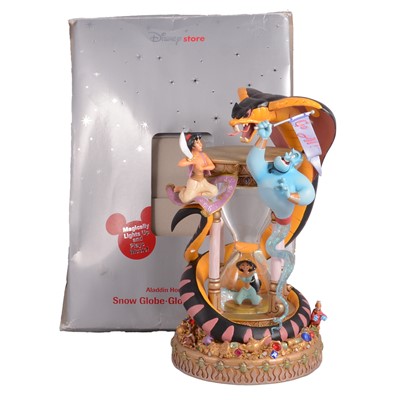 Lot 208 - Disney Store, two musical Snow Globes: 'Aladdin - Hourglass' and 'The Chronicles of Narnia'