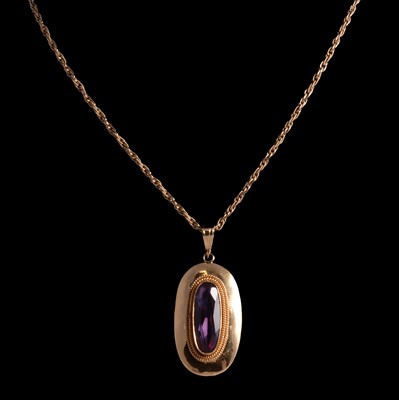 Lot 345 - A purple synthetic corundum pendant and chain.