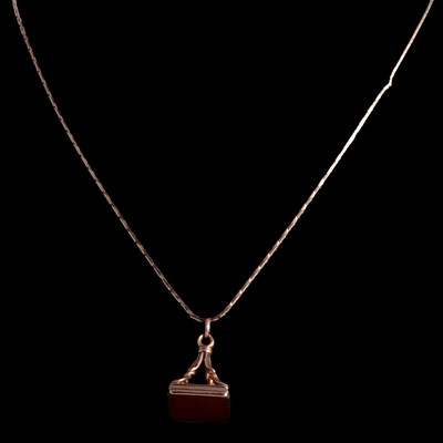 Lot 394 - A cornelion fob pendant and chain.