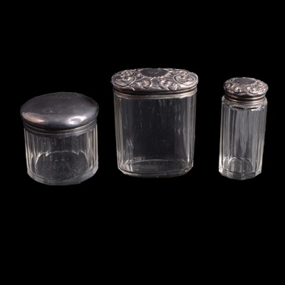 Lot 181 - Three silver-mounted glass dressing table bottles