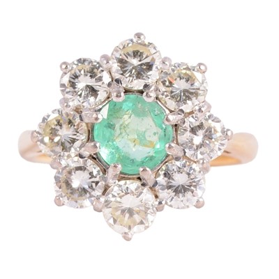 Lot 2 - An emerald and diamond cluster ring.