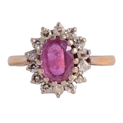 Lot 18 - A ruby and diamond cluster ring.