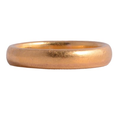 Lot 112 - A 22 carat gold wedding band.