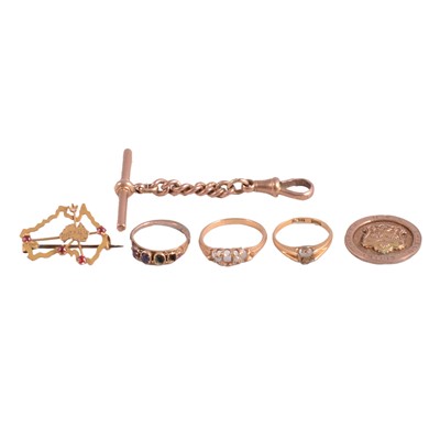 Lot 372 - Three gemset rings, a gemset brooch, chain with T bar and swivel fastener, and gold shield disc.