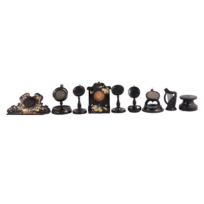 Lot 130 - Collection of ebonised or lacquered watch stands, 19th century