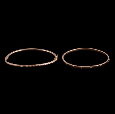 Lot 290 - Two gold / yellow metal broken bangles.