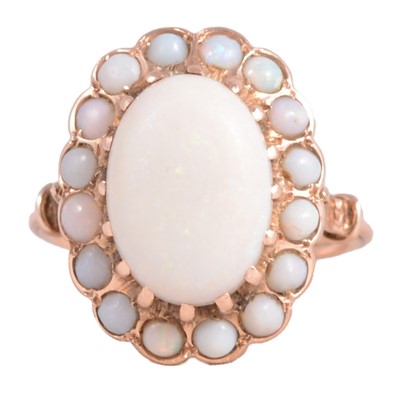 Lot 192 - An opal cluster ring and pair of earrings.