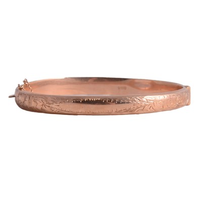 Lot 234 - A 9 carat rose gold half hinged bangle.