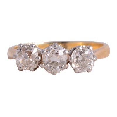 Lot 48 - A diamond three stone ring.