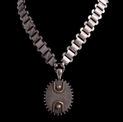 Lot 429 - A Victorian hallmarked silver locket and white metal collar.