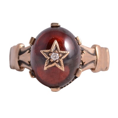 Lot 14 - A garnet and diamond ring.