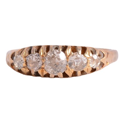 Lot 57 - A diamond five stone ring.