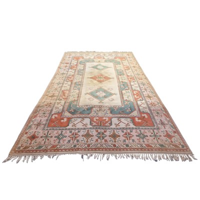 Lot 563 - Turkish wool rug featuring a central medallion...