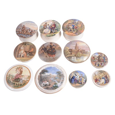 Lot 21 - A collection of Prattware pots and pot lids