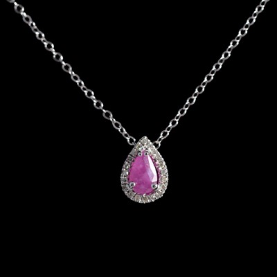 Lot 189 - A ruby and diamond pendant on a chain.