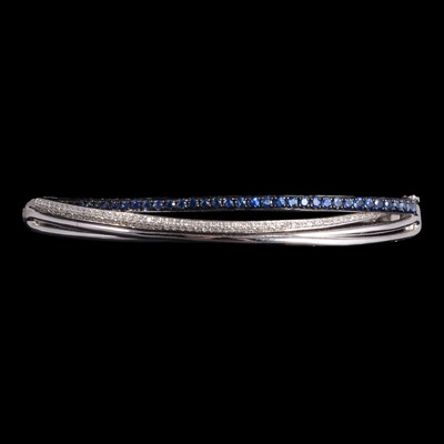Lot 160 - Effy - a sapphire and diamond half hinged bangle.