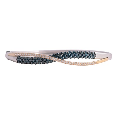 Lot 161 - A blue and white diamond crossover design bangle.