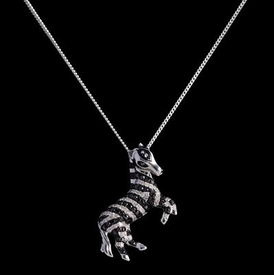Lot 211 - Effy - a zebra pendant on a chain.