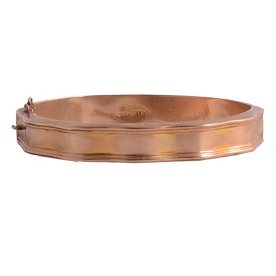 Lot 233 - A yellow metal half-hinged bangle.