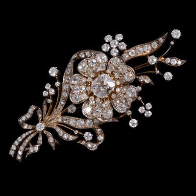 Lot 193 - A diamond flower brooch en-tremblant, with a large centre diamond.
