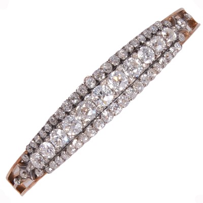 Lot 241 - A diamond set half hinged bangle.