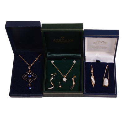 Lot 356 - A diamond pendant and matching earstuds, and three pendants on chains.