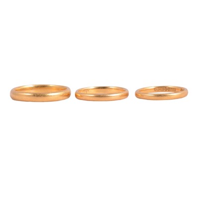 Lot 118 - Three 22 carat gold wedding bands.