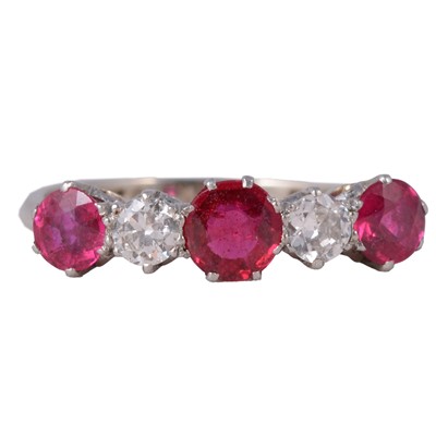 Lot 16 - A synthetic ruby and diamond half hoop ring.