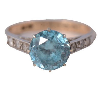 Lot 34 - A heat treated blue zircon and white stone (not diamond) ring.