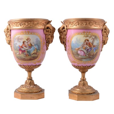 Lot 39 - Pair of Sevres style Rose Pompadour porcelain mounted gilt metal urns