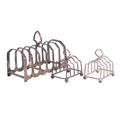 Lot 341 - Three silver toast racks