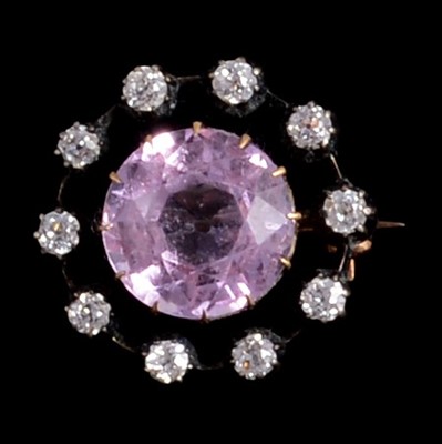 Lot 200A - A pink topaz and diamond brooch.