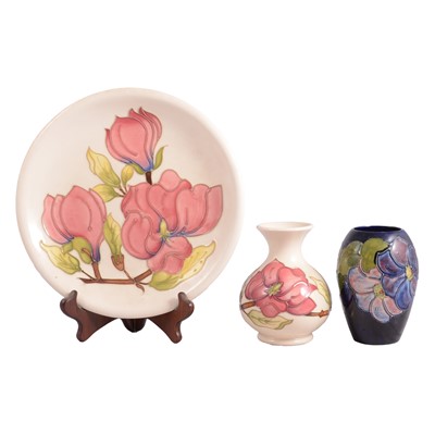 Lot 3 - Moorcroft Pottery, a 'Magnolia' pattern plate and vase, and an 'Anemone' vase
