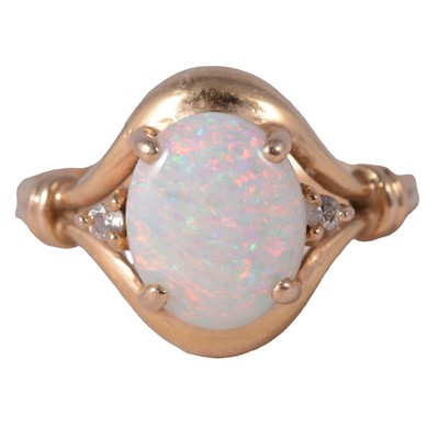 Lot 43 - An opal and diamond dress ring.