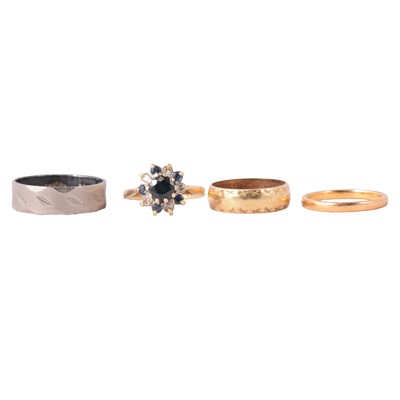 Lot 119 - Two gold wedding bands, 22 carat and 18 carat, a sapphire and diamond ring, and silver ring.