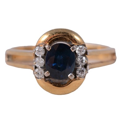 Lot 5 - A modern sapphire and diamond ring.