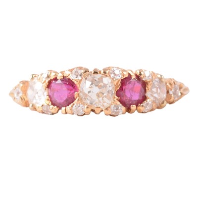 Lot 15 - A ruby and diamond ring.