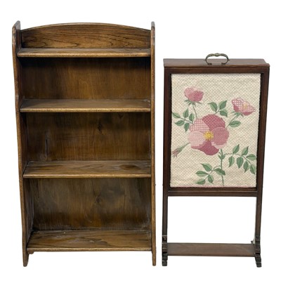 Lot 394 - Edwardian oak open bookcase, and a mahogany prayer screen
