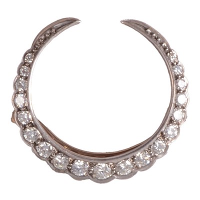 Lot 135 - A diamond closed crescent brooch.