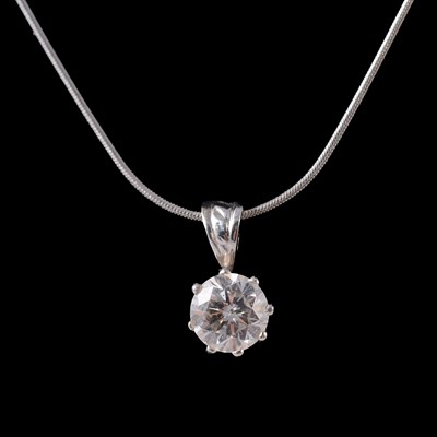 Lot 183 - A diamond solitaire pendant on a chain.