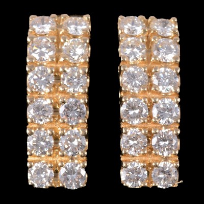 Lot 247 - A pair of diamond earclips.