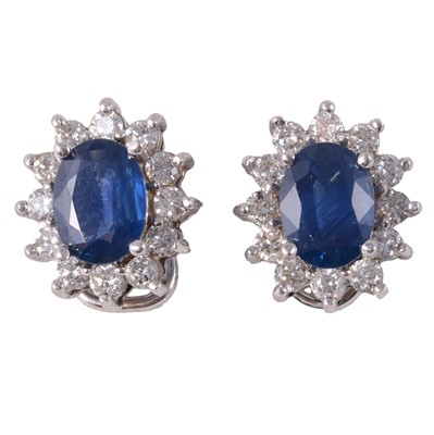 Lot 252 - A pair of sapphire and diamond cluster earclips.