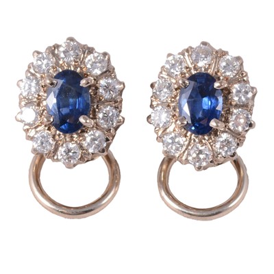 Lot 253 - A pair of sapphire and diamond cluster earclips.